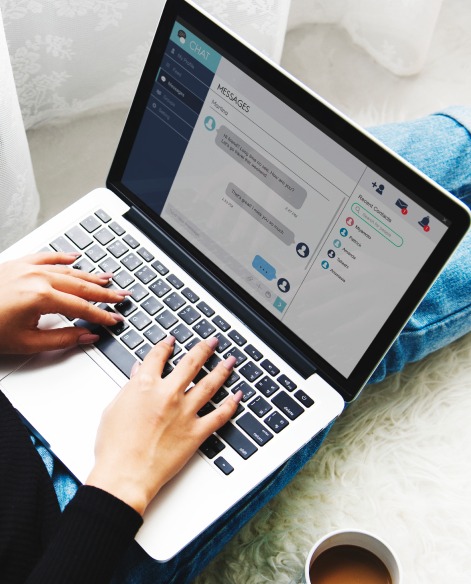 Woman sitting floor using laptop 1